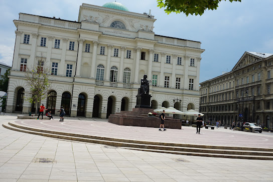 Old Town Warsaw starts with the statue of Copernicus and the Academy of Science